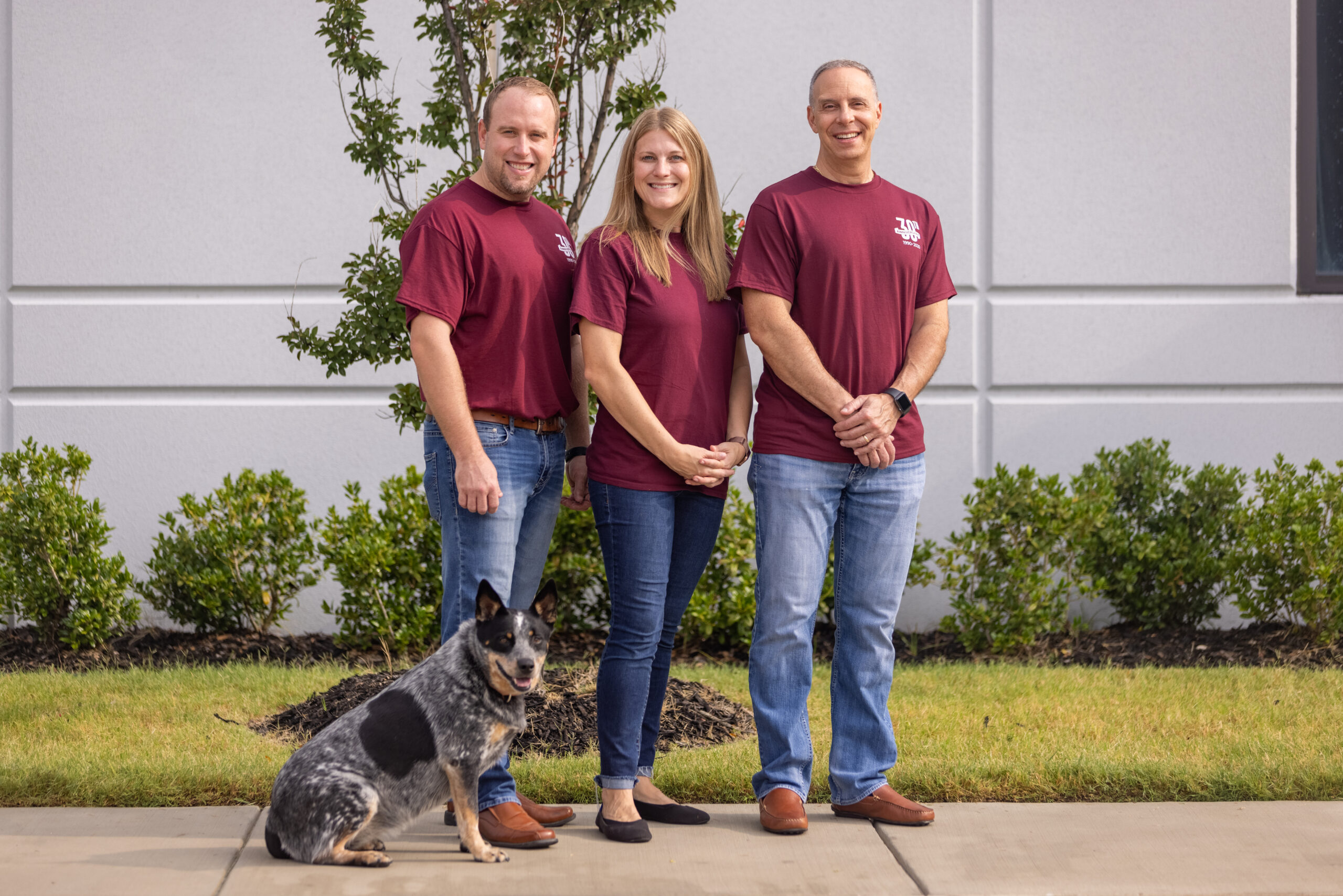 Image of our leadership: Ryon Ray, Heather Young, and Loren Sloane, with our mascot, Agua the Blue Heeler